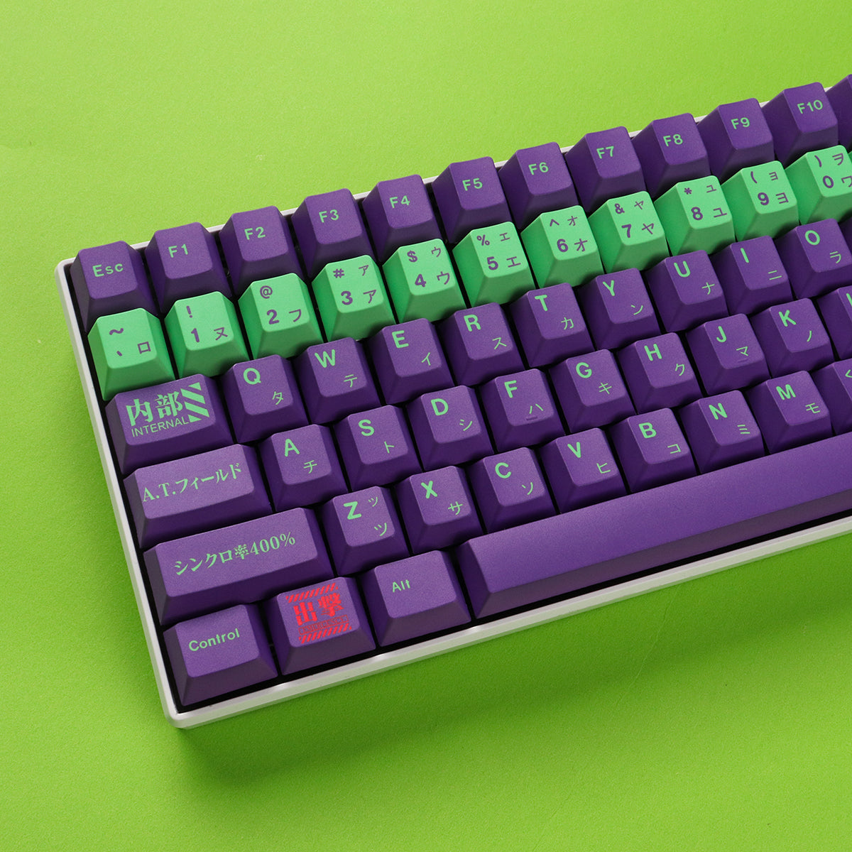 A close-up image of a mechanical keyboard featuring purple and green keycaps with neon-inspired designs and Japanese characters. The keyboard has a white base and includes keys for numbers, letters, symbols, and navigation.