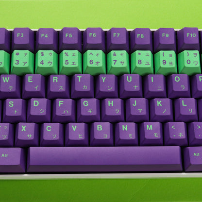 A close-up image of a mechanical keyboard with a white base and purple and green keycaps. The keycaps feature neon-inspired designs and Japanese characters.